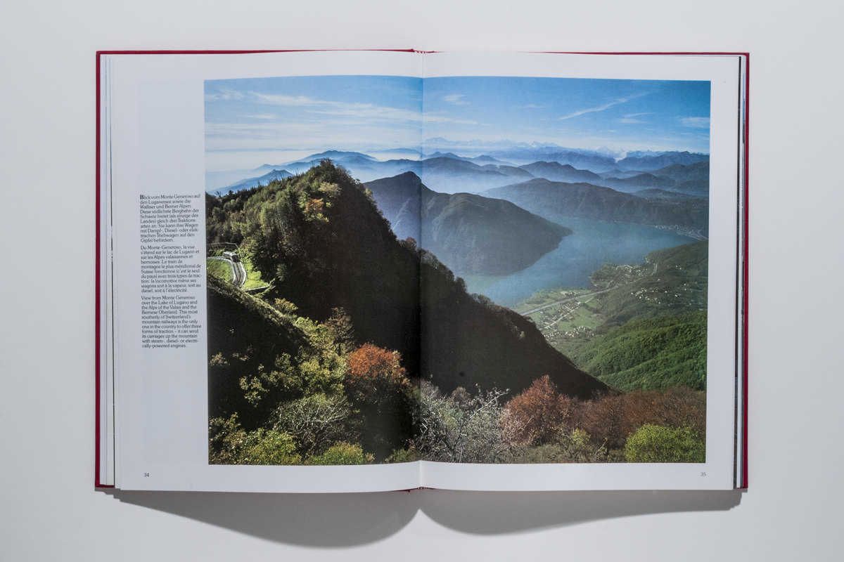 Die Monte-Generoso-Bahn, links aussen, mit Blick auf den Luganersee und die Walliser und Berner Alpen.